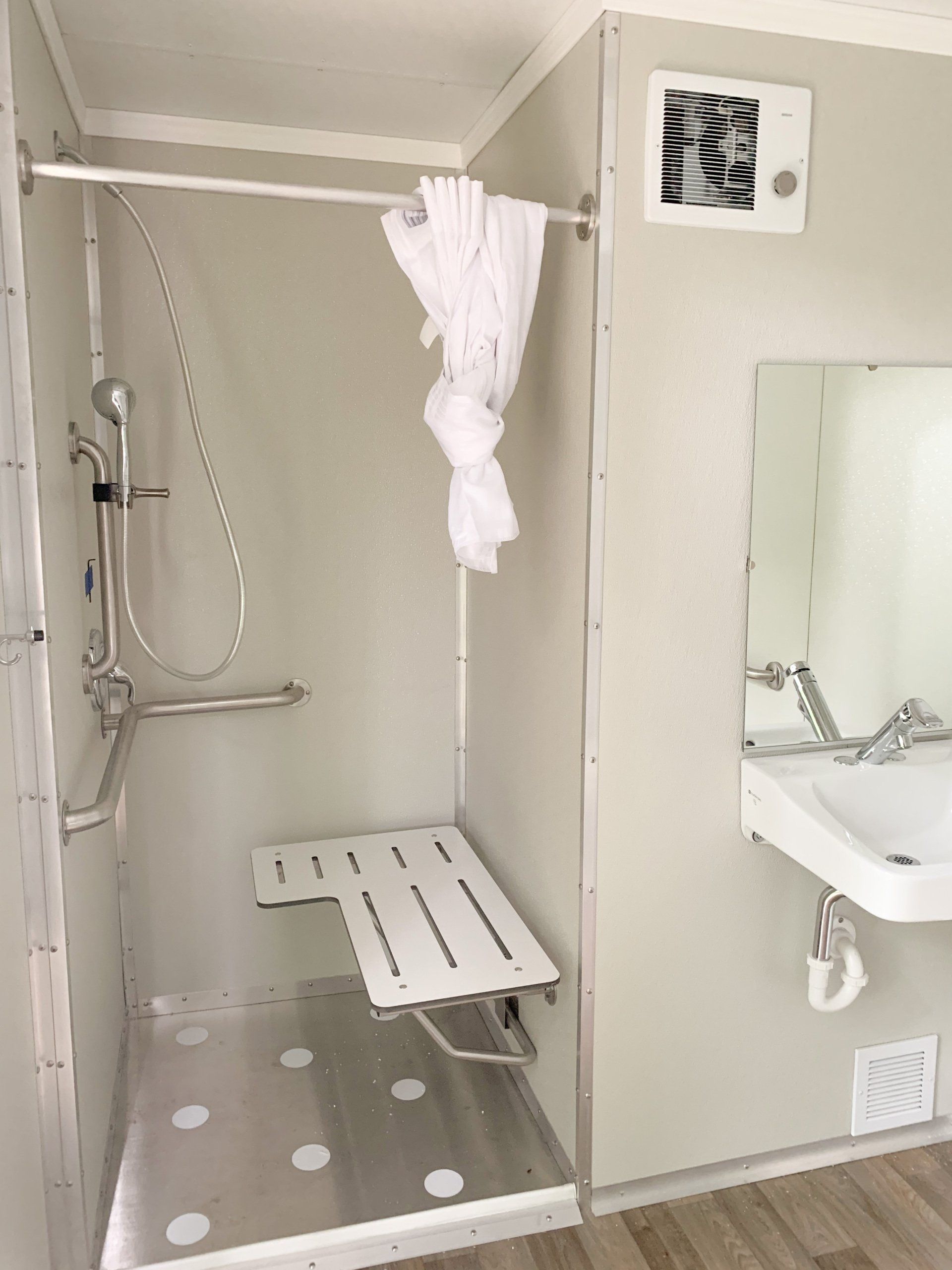 Accessible shower with handheld shower head