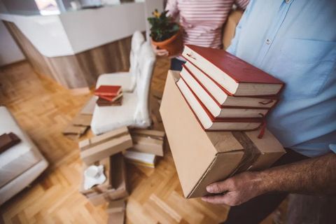 Man Holding Box And Books — Fairmont, WV — Pevler Law