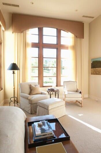A living room filled with furniture and a large window