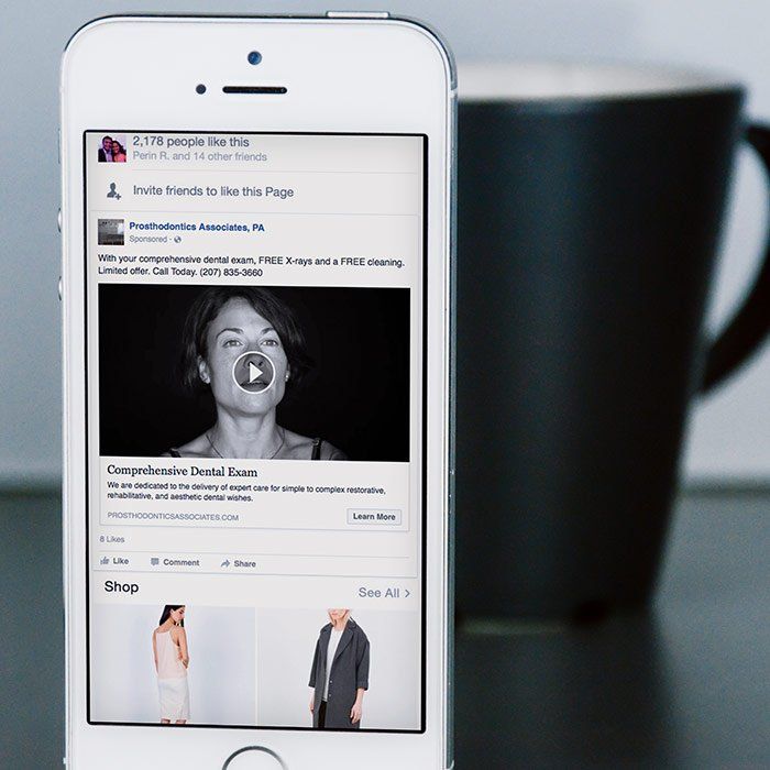 A cell phone with a picture of a woman on the screen