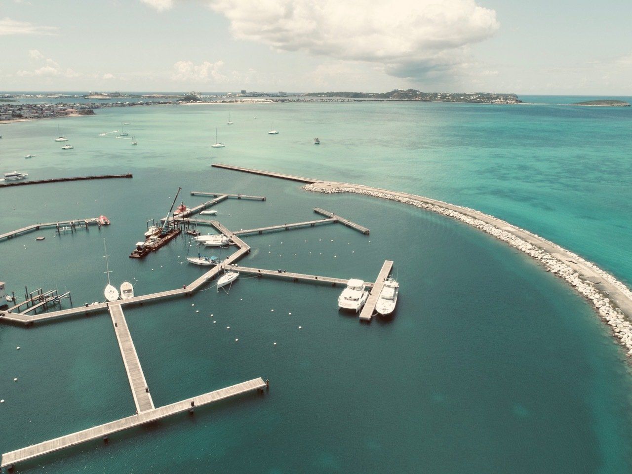 An aerial view of a marina with boats docked