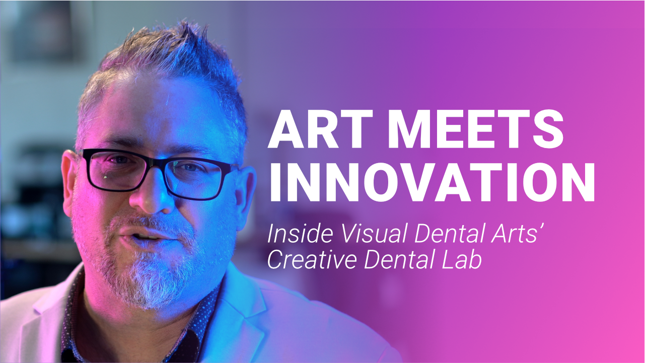 A woman is sitting at a table with a cup of coffee and a laptop.