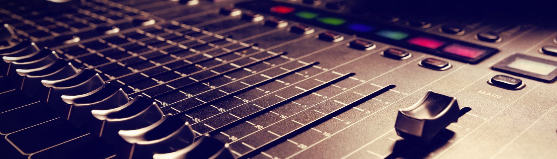 A close up of a mixer with a lot of buttons on it.