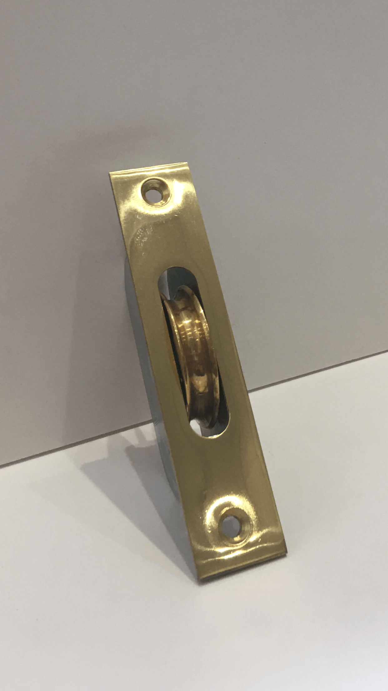 Polished brass sash window pulley
