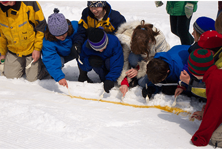 Kids making sugar on snow