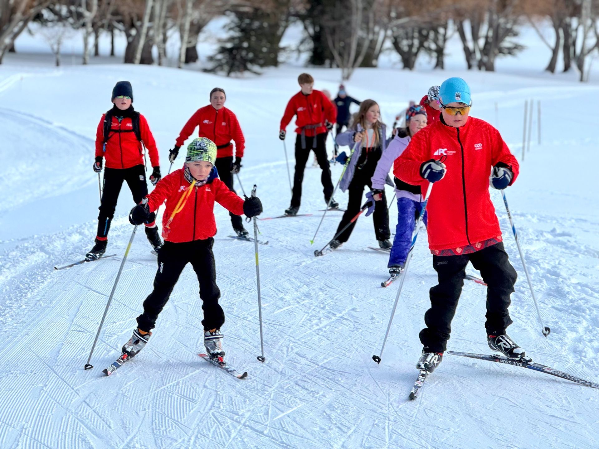 Devo and Kickers and Glider ski together during a mentorship day at White Pine