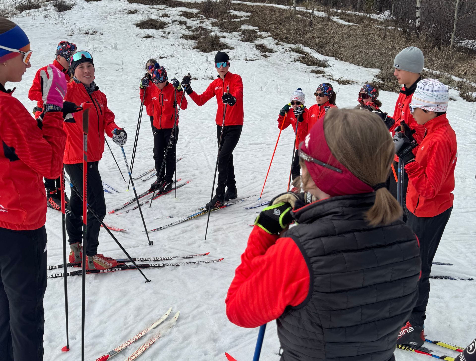 Junior Comp Head Coach McKinley Hibl talks to athletes.