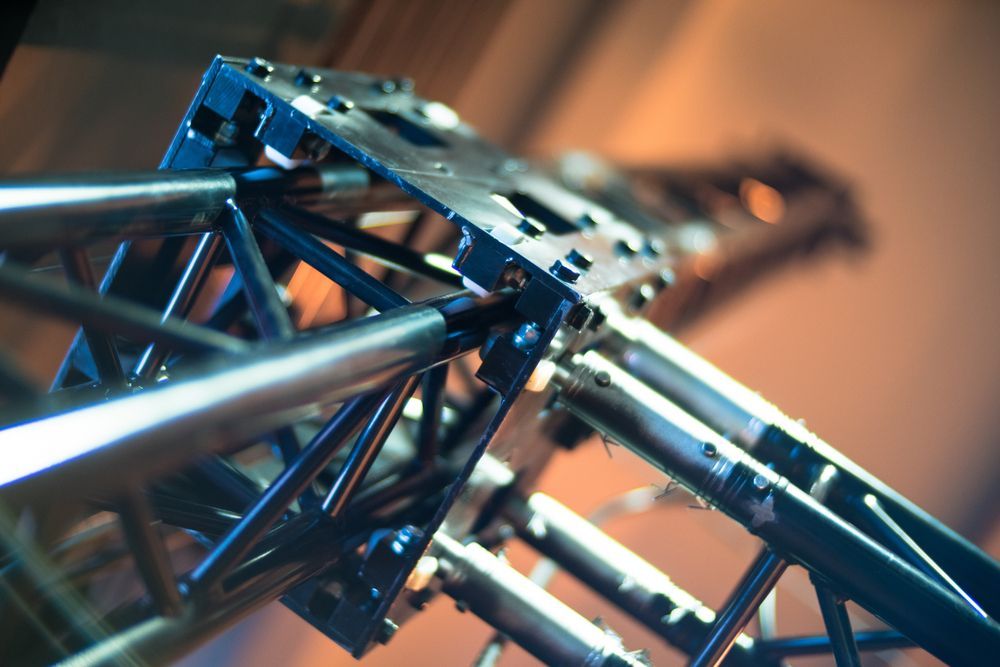 Close-up of a Black Metal Truss Structure With Silver Support Beams — Kennedy Amplifier Hire Service In South Mackay, QLD