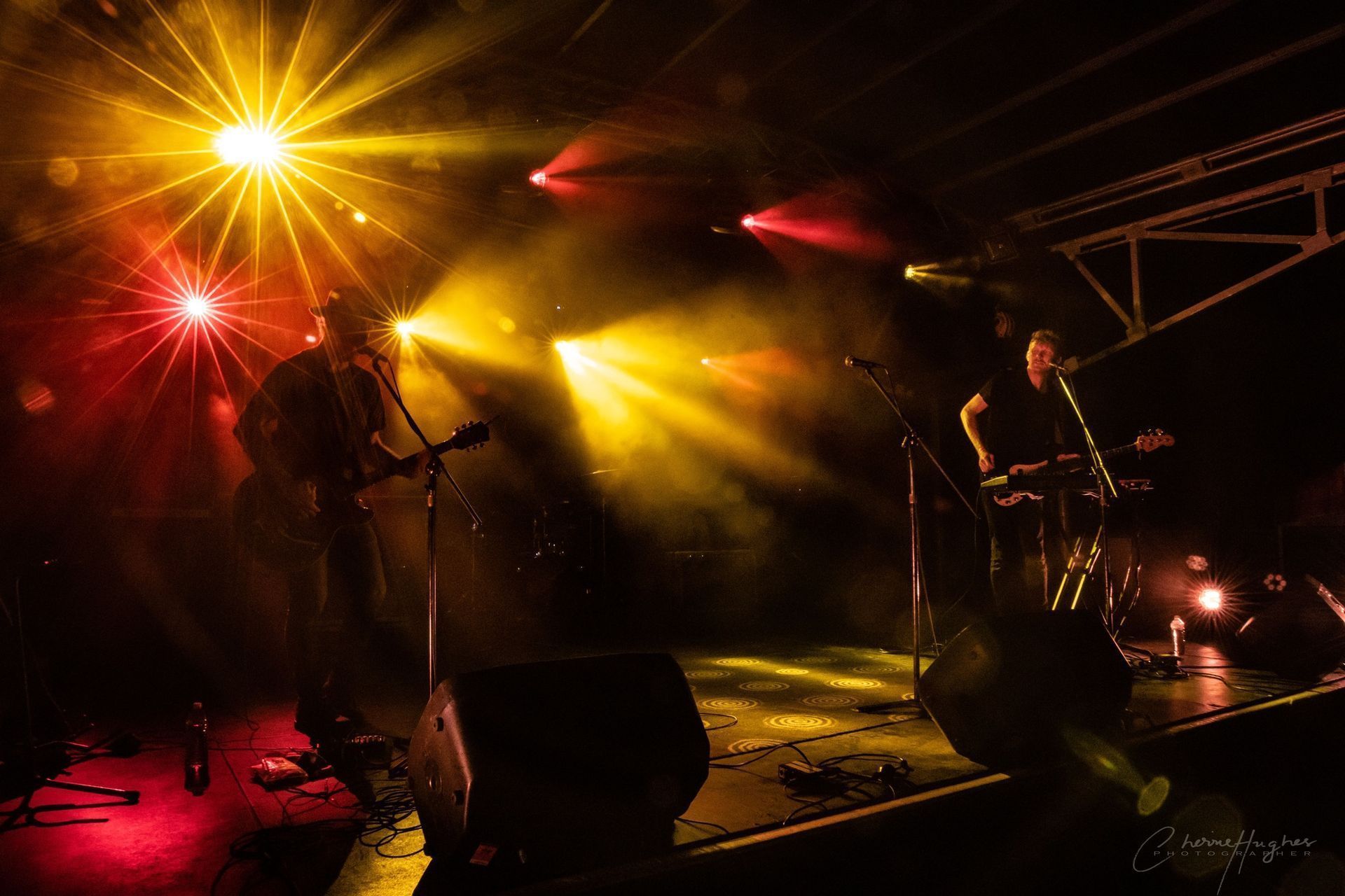 Two Musicians Performing On Stage Under Stage Lights — Kennedy Amplifier Hire Service In South Mackay, QLD