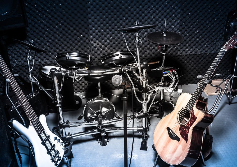 Drum Set, Bass, And Acoustic Guitar In A Recording Studio — Kennedy Amplifier Hire Service In South Mackay, QLD