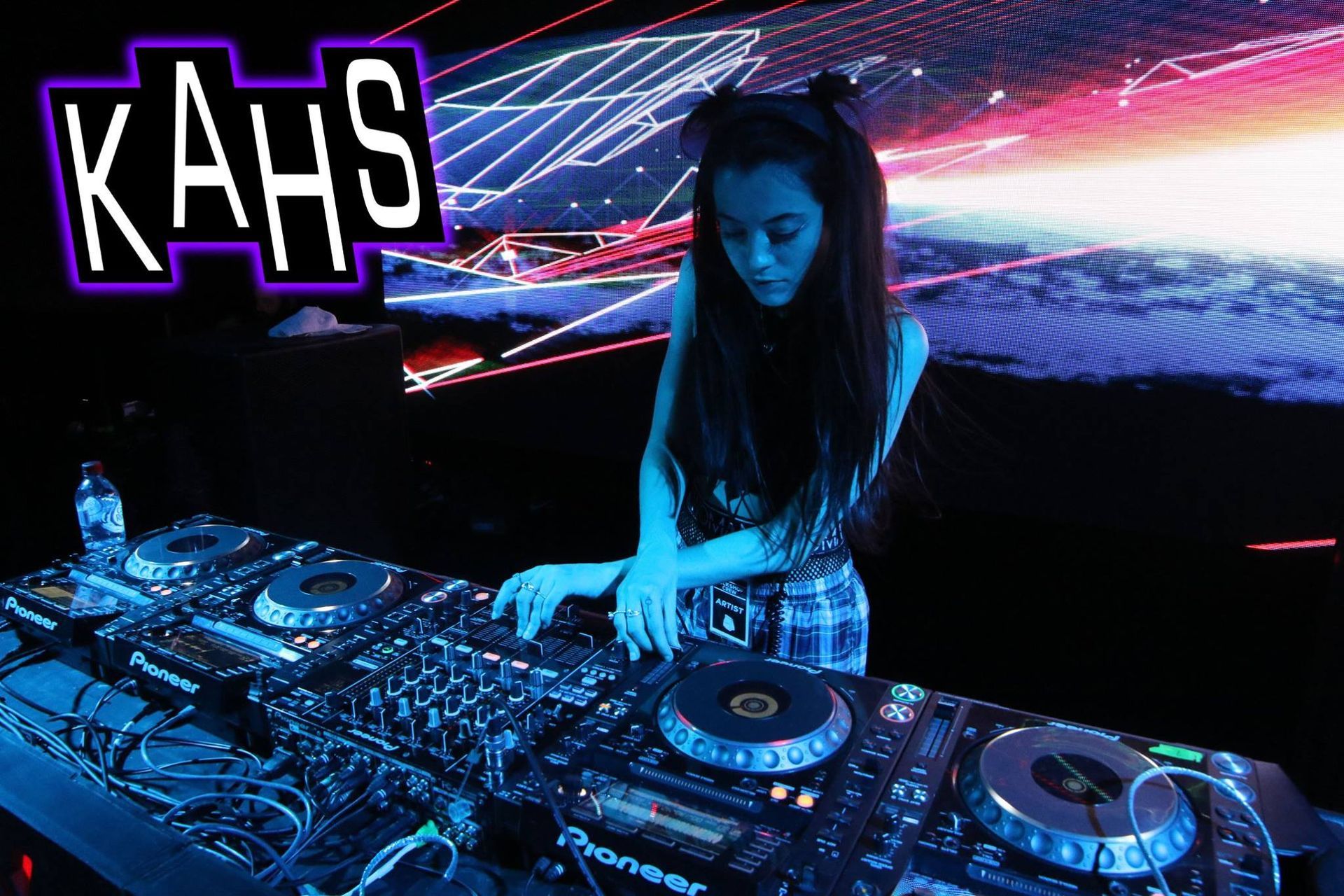 A Dj, Kahs, At A Club With Blue And Purple Lighting — Kennedy Amplifier Hire Service In South Mackay, QLD