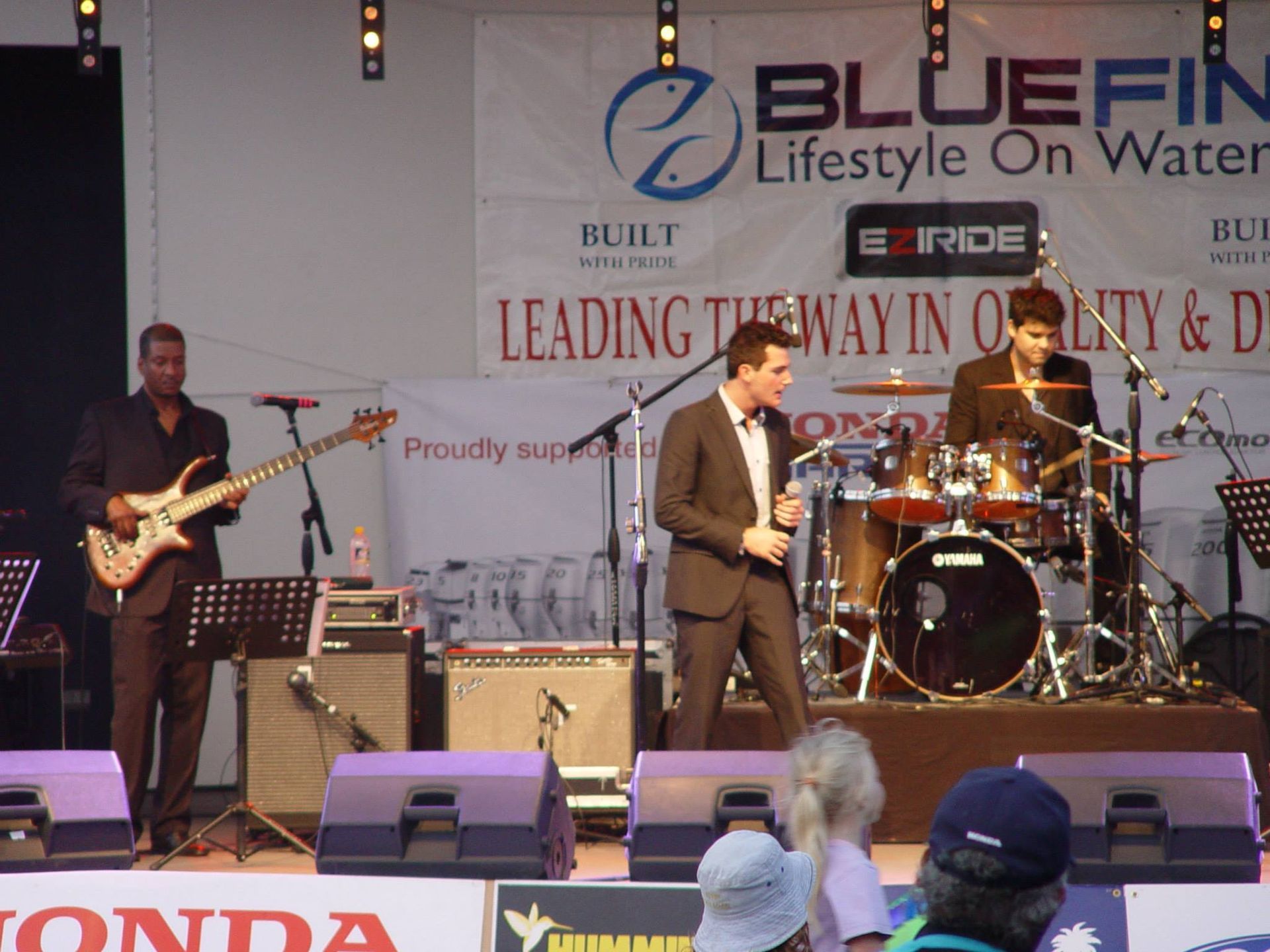 Band Performing On Stage At Outdoor Event — Kennedy Amplifier Hire Service In South Mackay, QLD
