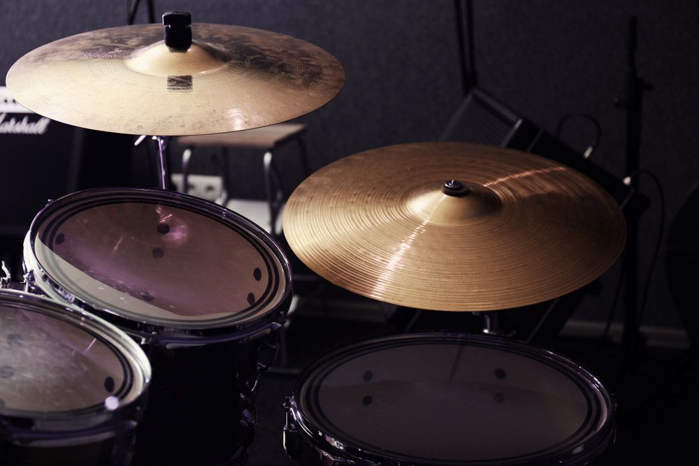 Drum Kit With Cymbals. Drums Are In A Dimly Lit Setting — Kennedy Amplifier Hire Service In South Mackay, QLD