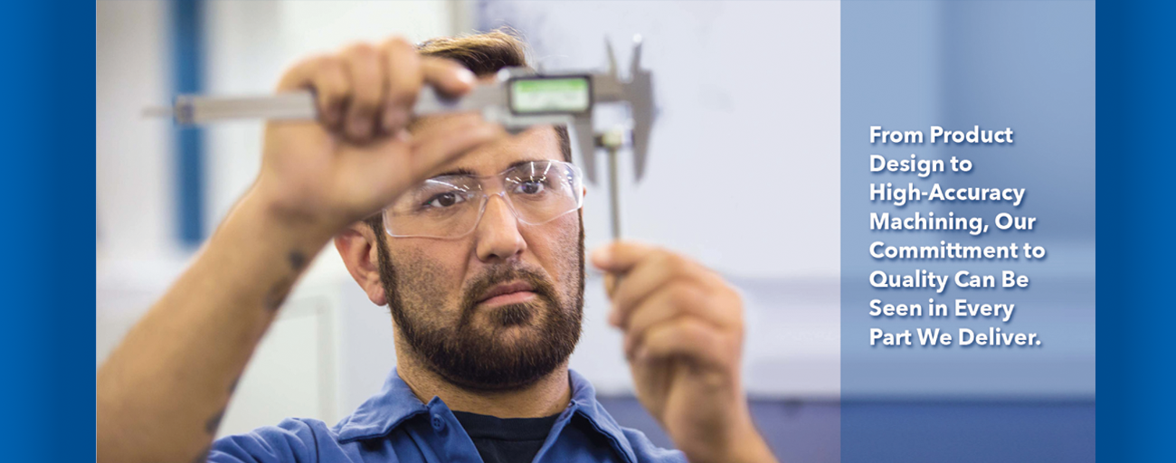 A man with a beard is measuring something with a caliper.