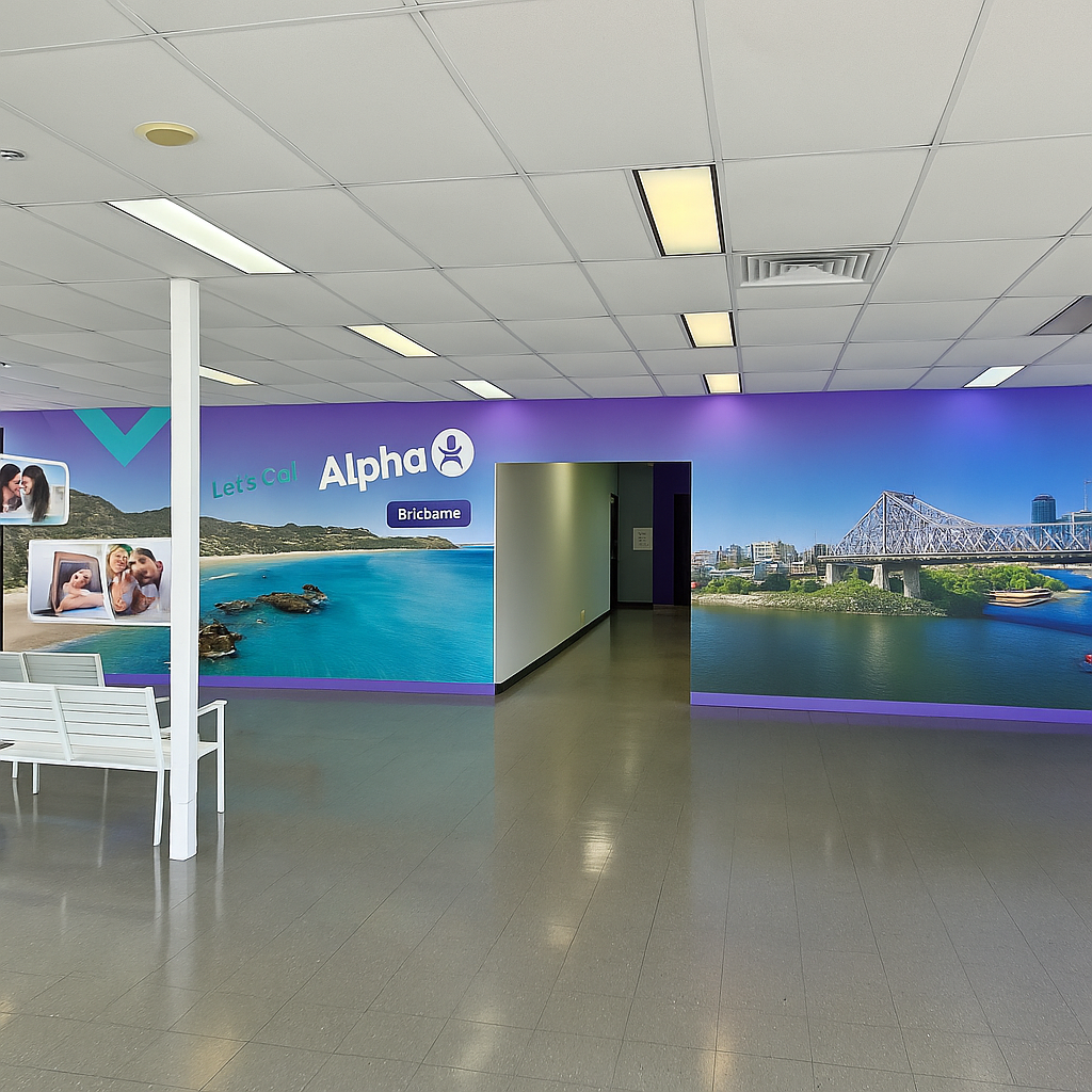 Waiting room with purple and white walls, and images of a beach and city skyline.
