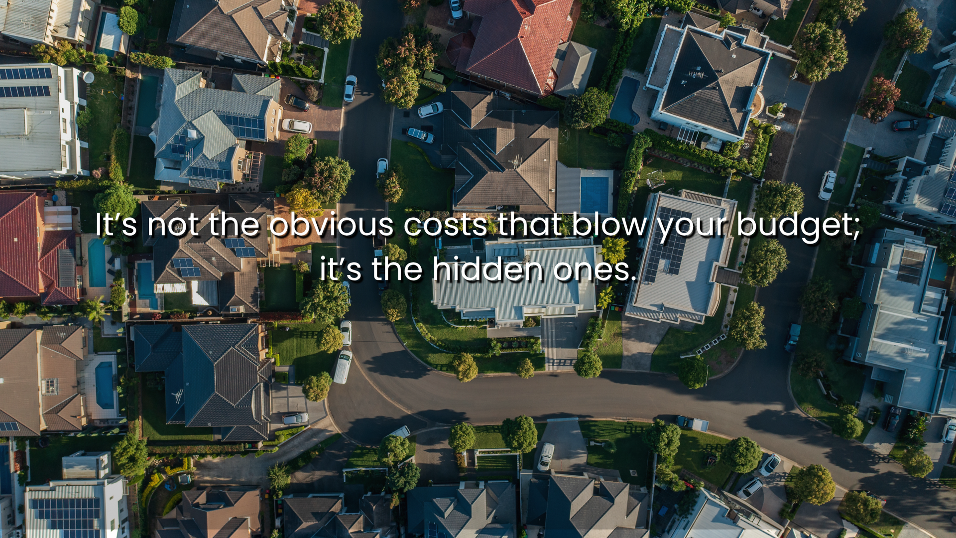 Aerial view of a suburban neighborhood with houses, driveways, and swimming pools, overlaid with the text: