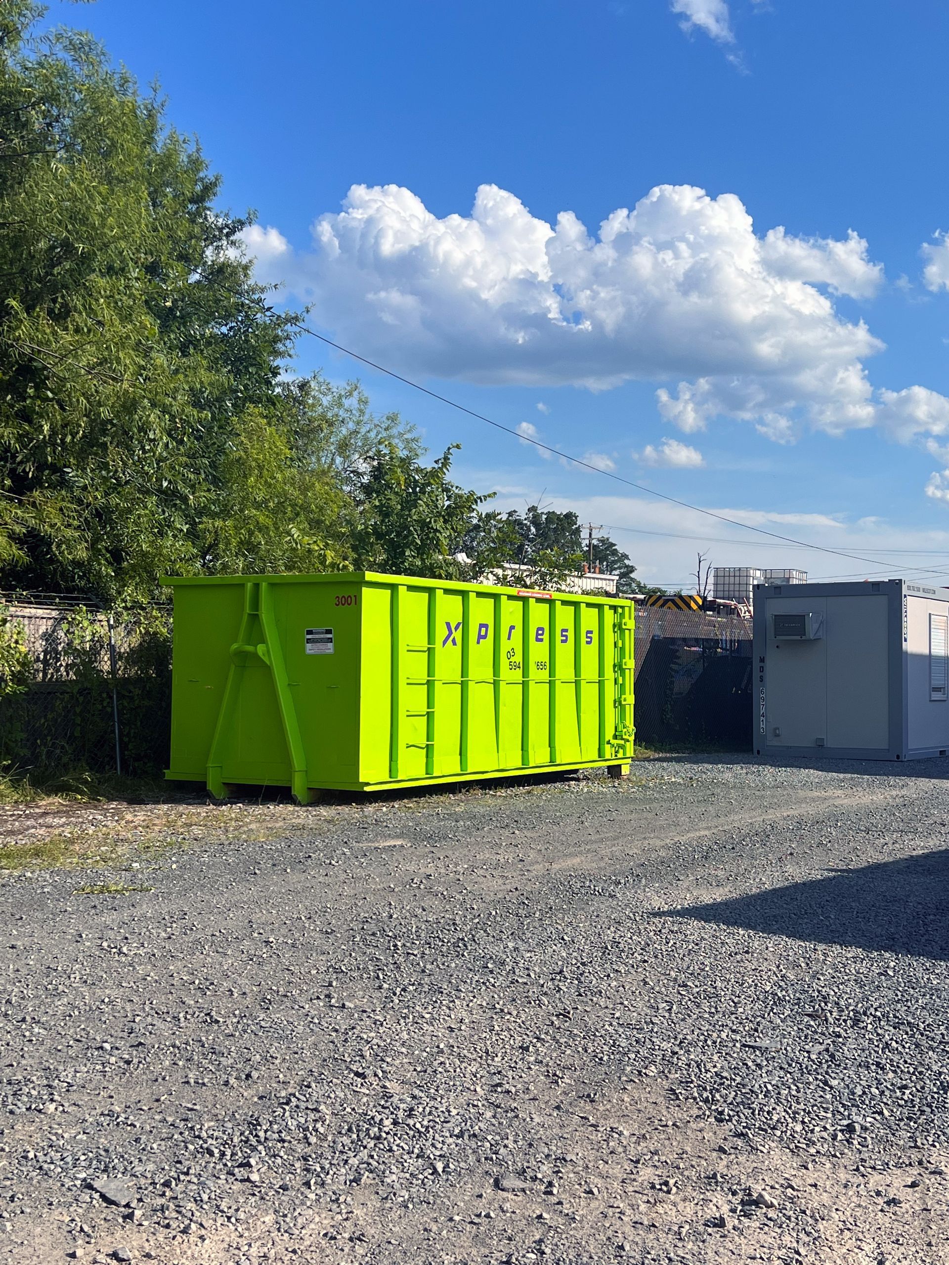 A 30 yard dumpster positioned at a commercial site in Manassas, VA, ideal for large-scale cleanouts.