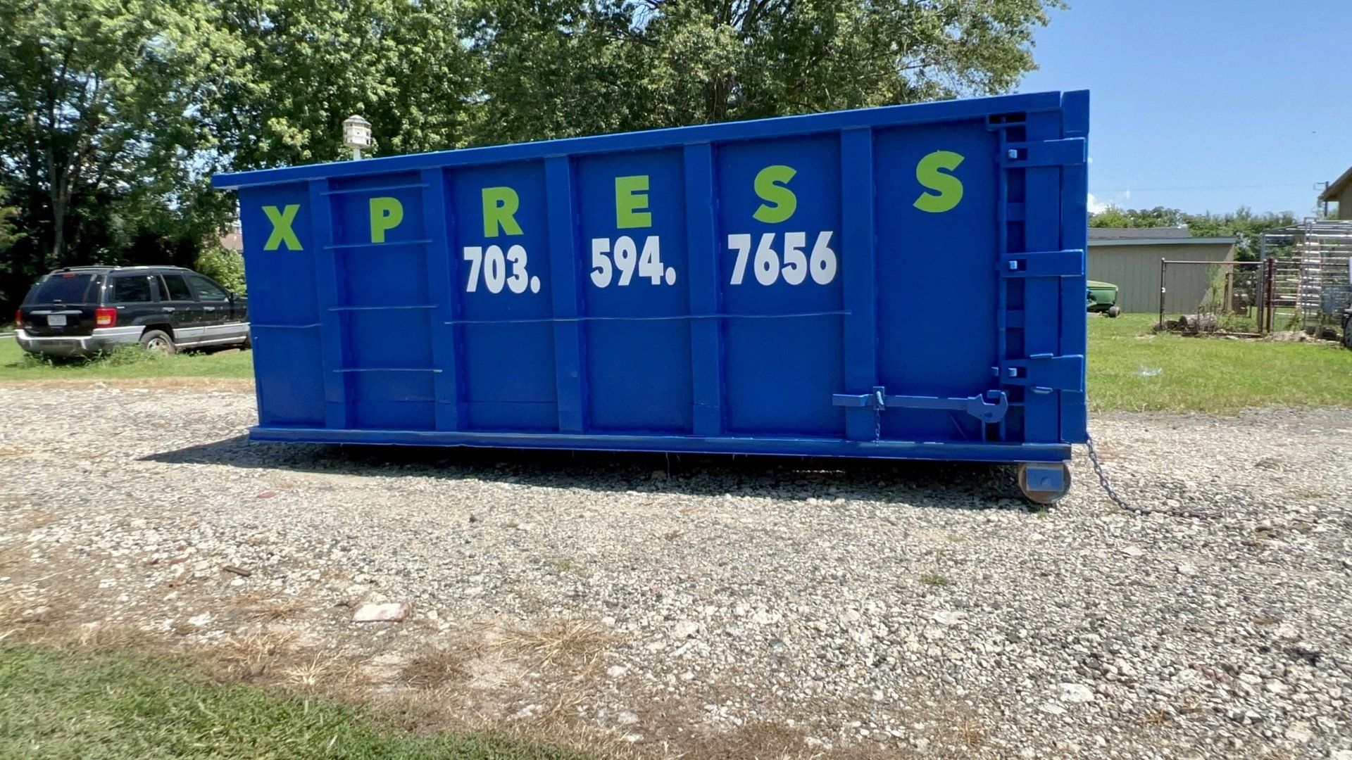a blue dumpster that says xpress on it