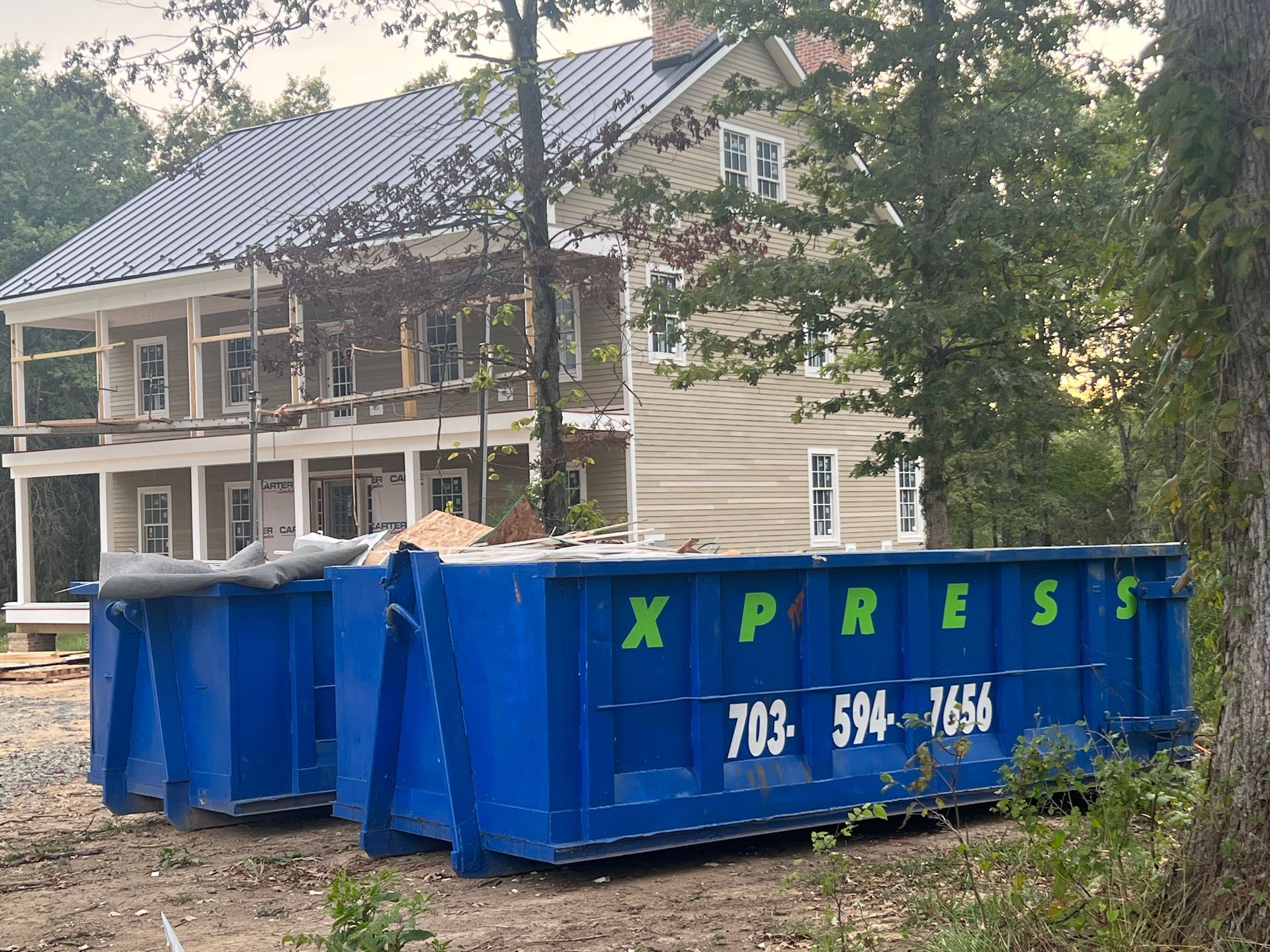 A side view of a 30 yard dumpster in Marshall, VA, highlighting its size and dimensions.