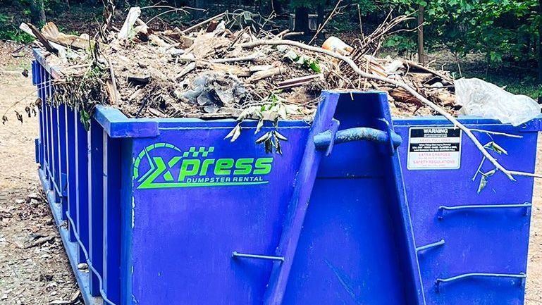 Xpress Dumpster Rentals team helping with post-storm cleanup in Manassas, VA