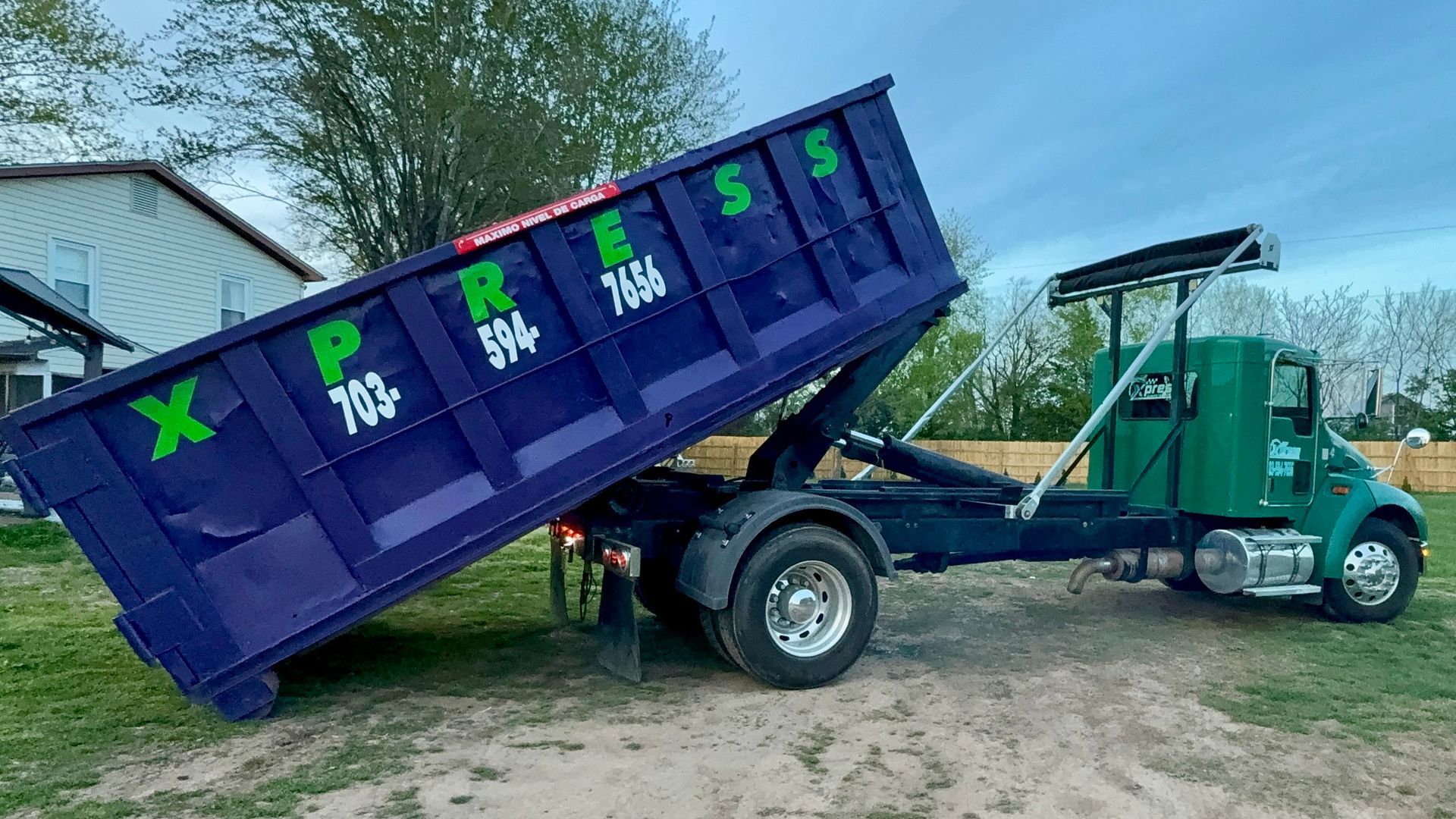 Roll-off dumpster delivery in Warrenton VA by Xpress Dumpster Rentals using hook lift truck