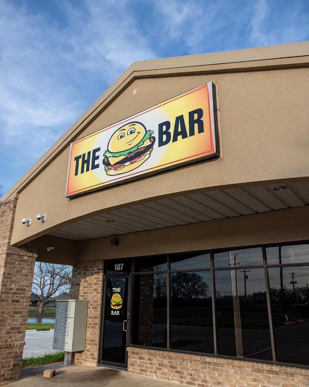 A building with a sign that says the bar on it