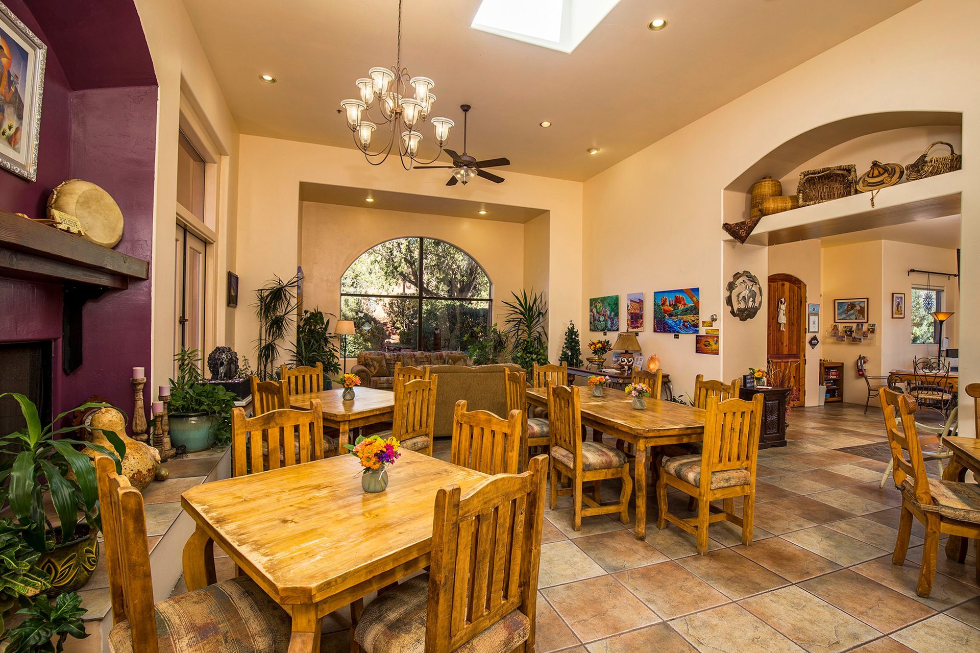 A large dining room with wooden tables and chairs.