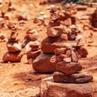 A group of rocks stacked on top of each other in the desert.