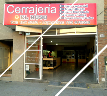 Un cartel rojo que dice cerrajería.