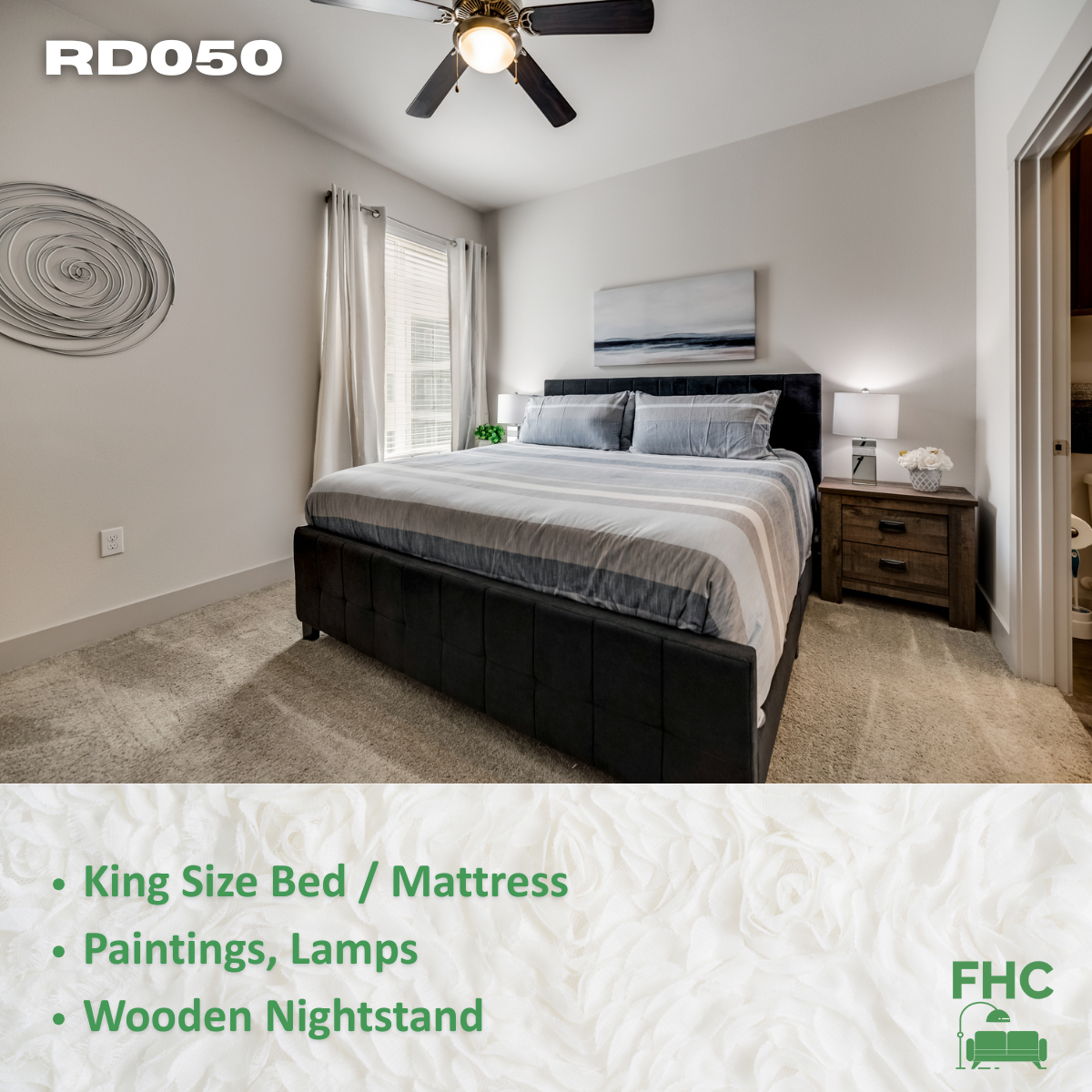 A bedroom with a king size bed and a ceiling fan