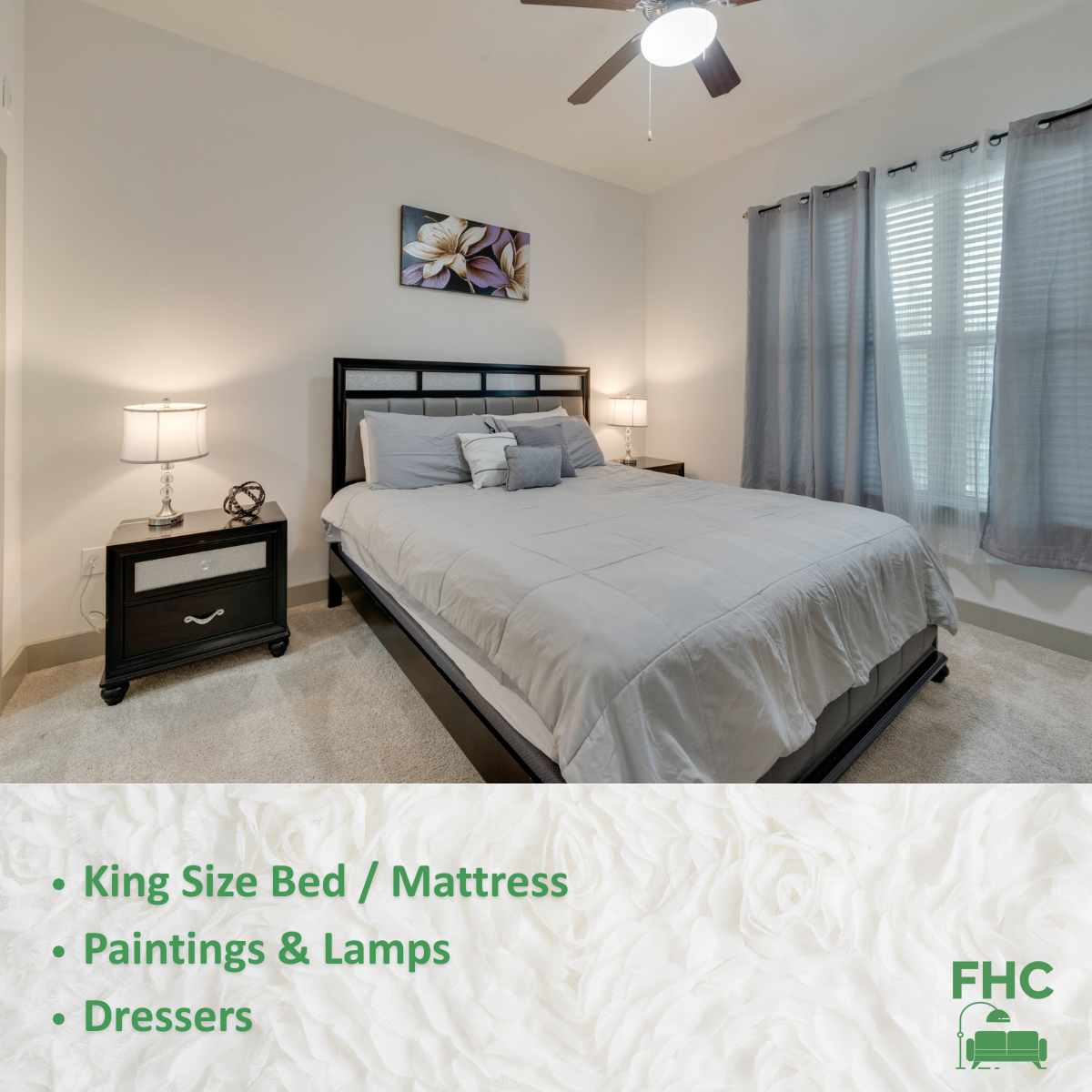 A bedroom with a king size bed and a ceiling fan