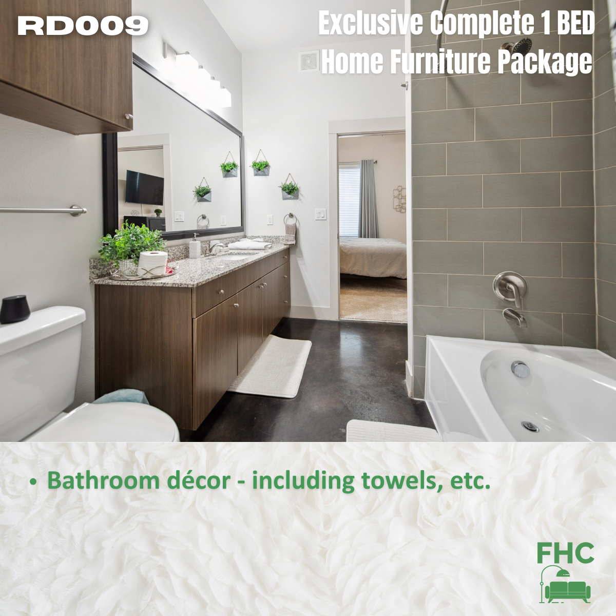 Bathroom with furniture package, including towels and décor.