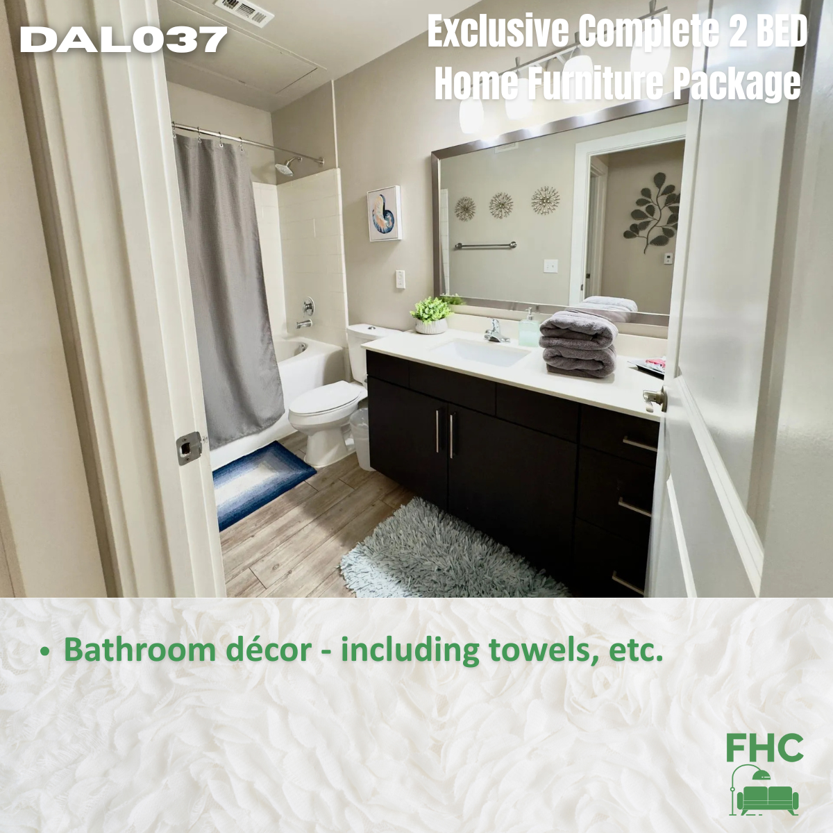 Bathroom with dark vanity, towels, gray shower curtain, and decor. Text: 