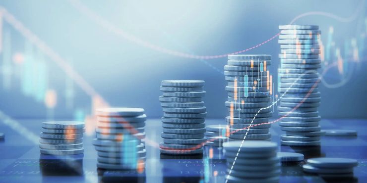 Stacks of coins increase in height, overlaid with charts showing financial growth.