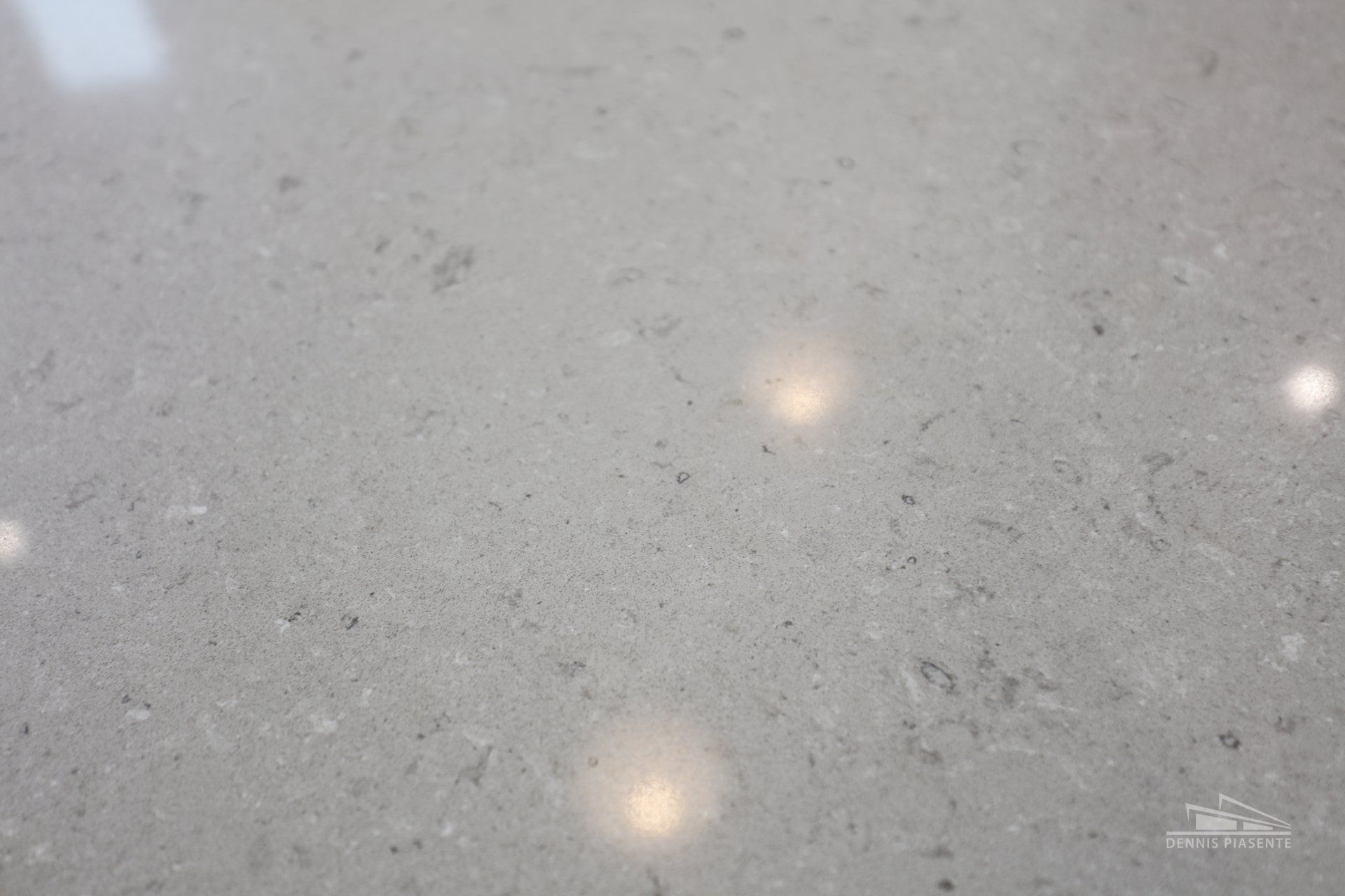 A close up of a gray granite counter top.