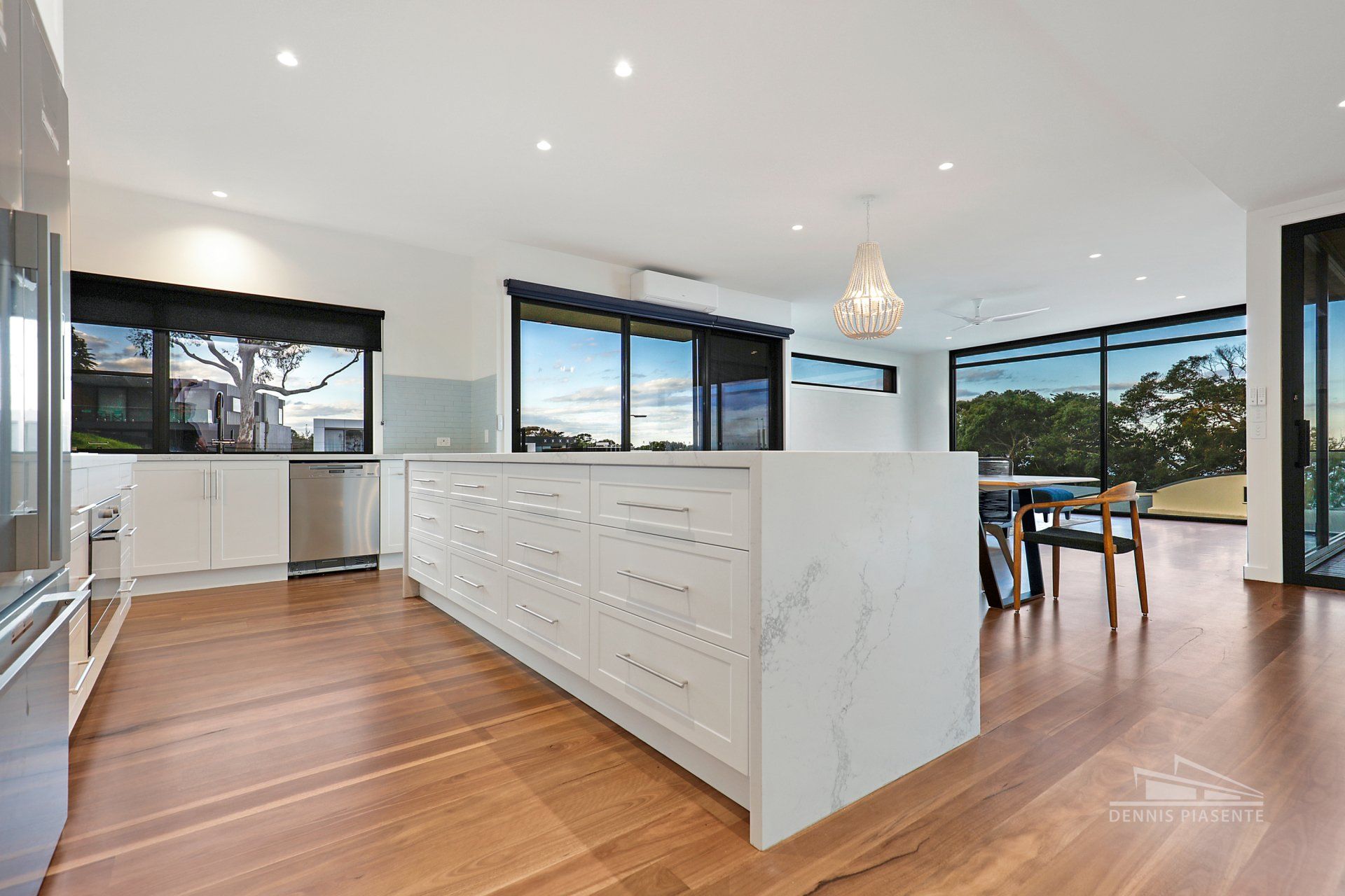 There is a large island in the middle of the kitchen.