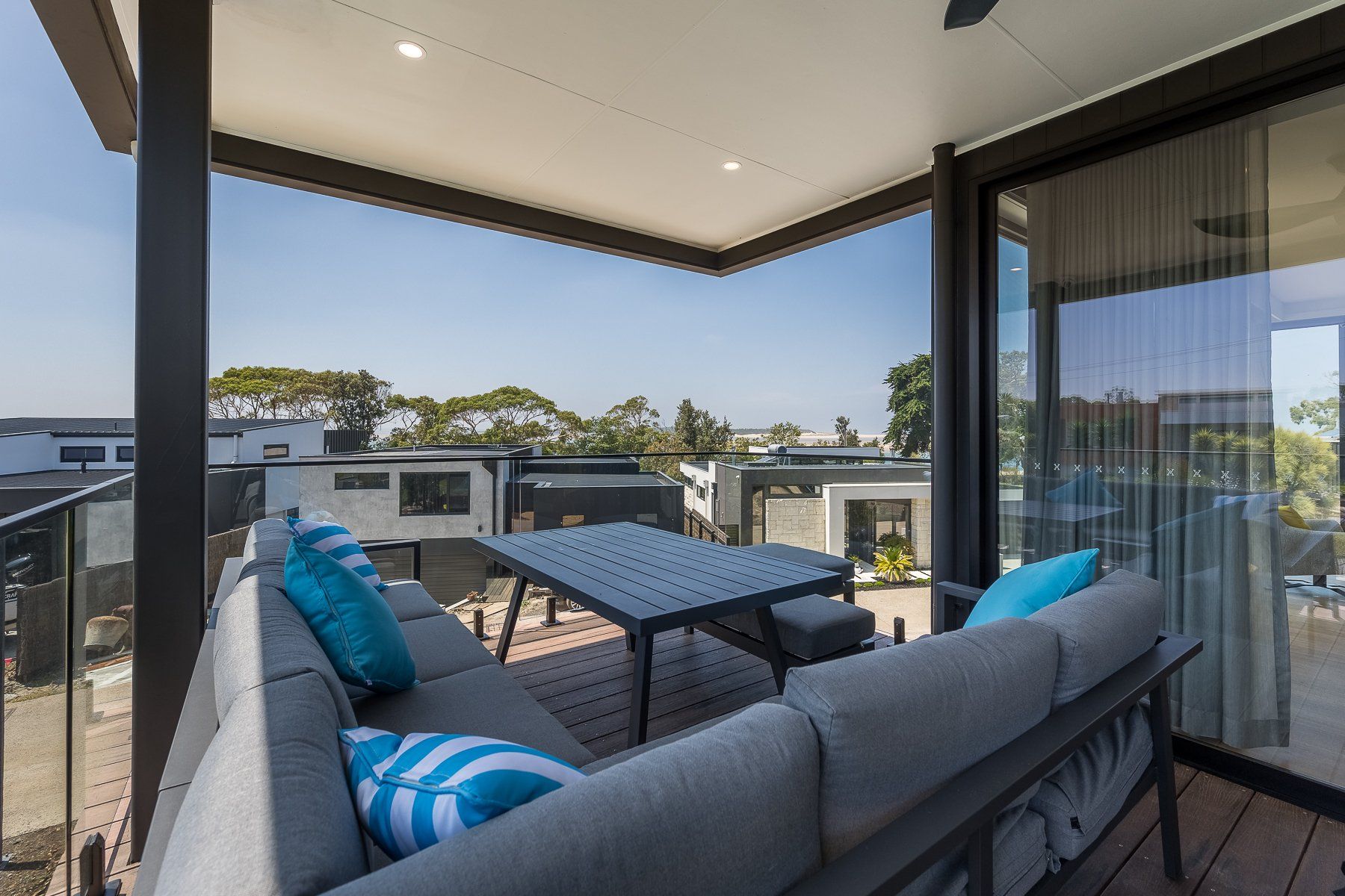 A balcony with a couch and a table on it
