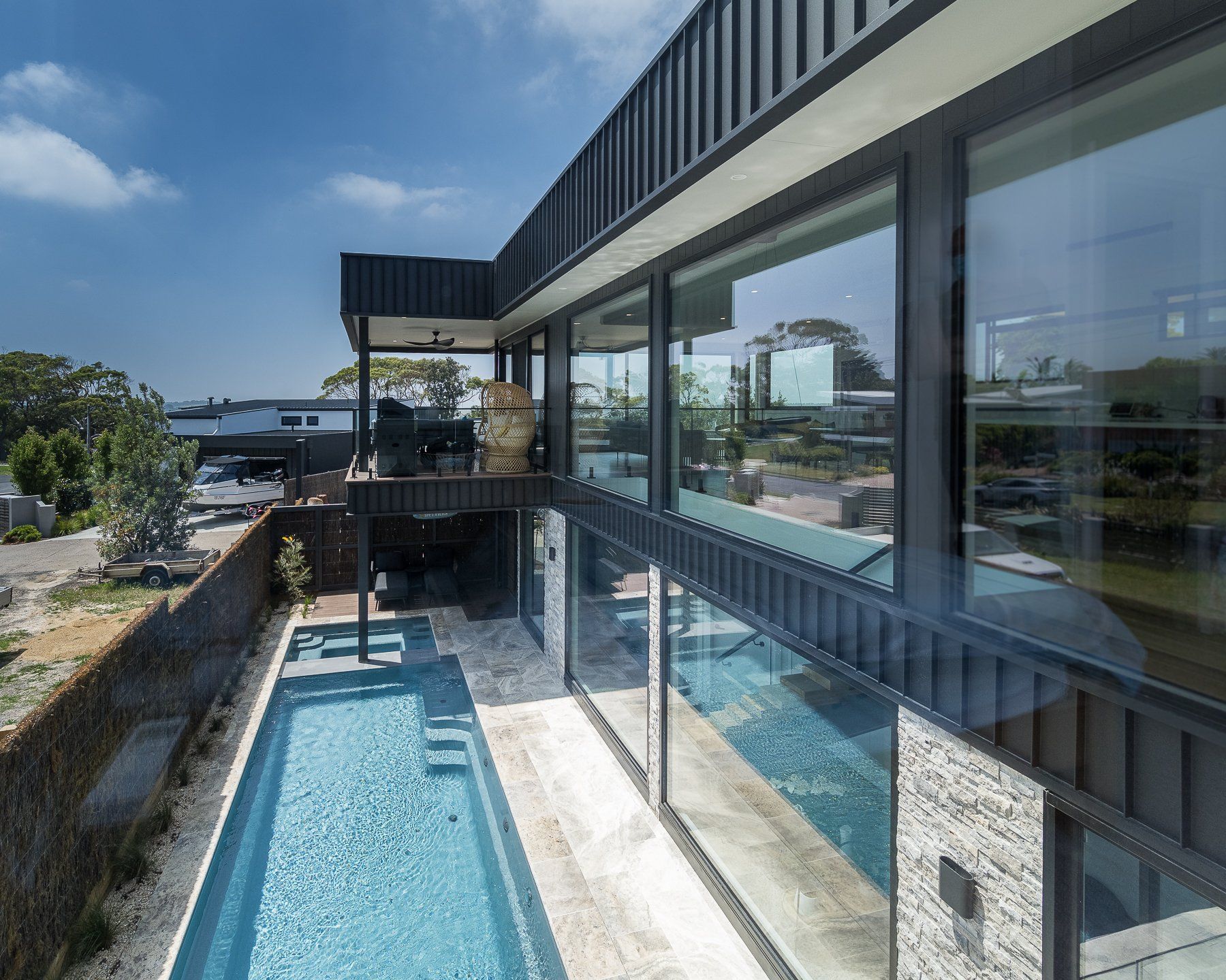 A large house with a large swimming pool in the backyard.