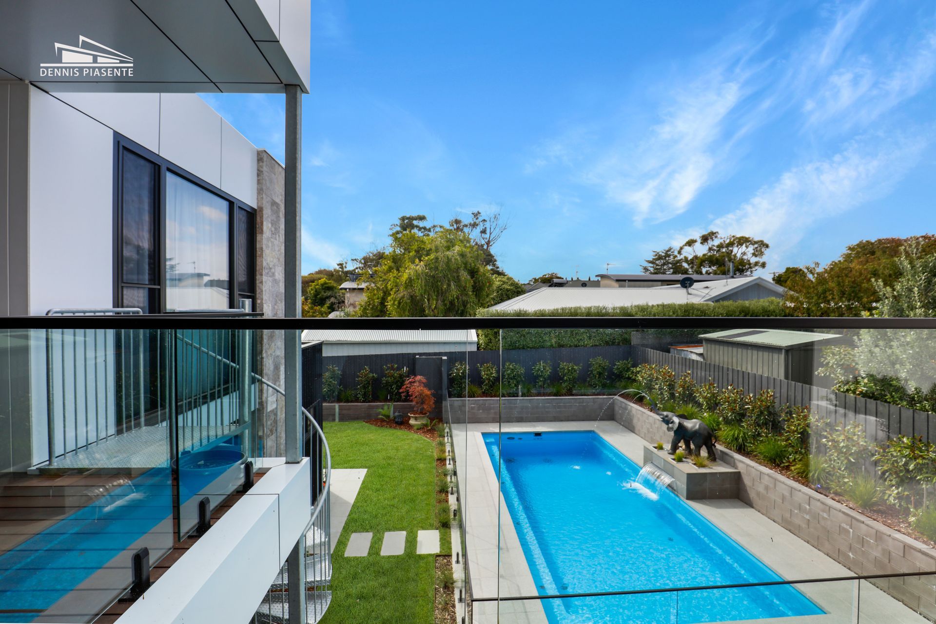 A large swimming pool in the backyard of a house