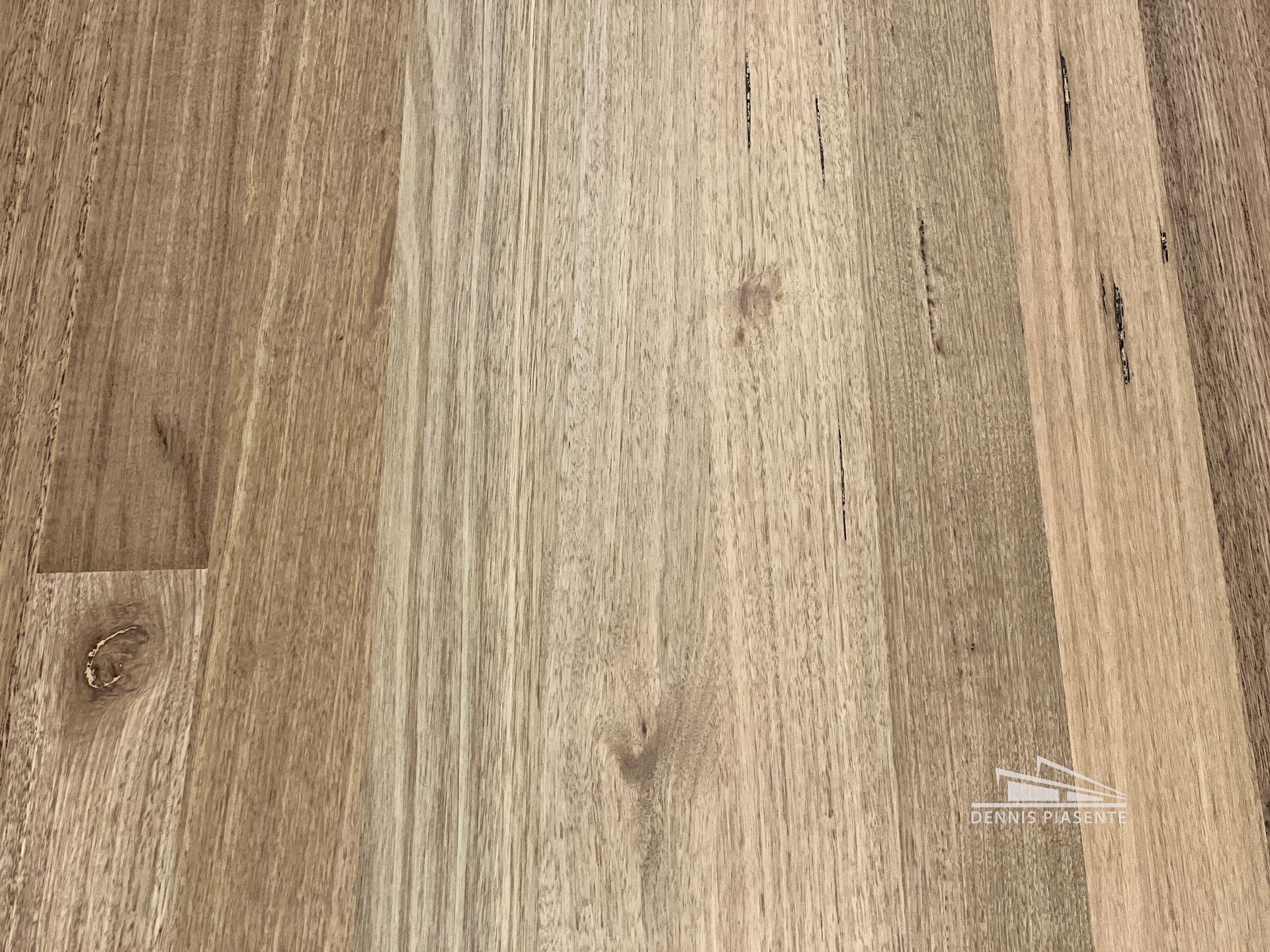 A close up of a piece of wood showing the grain of the wood.