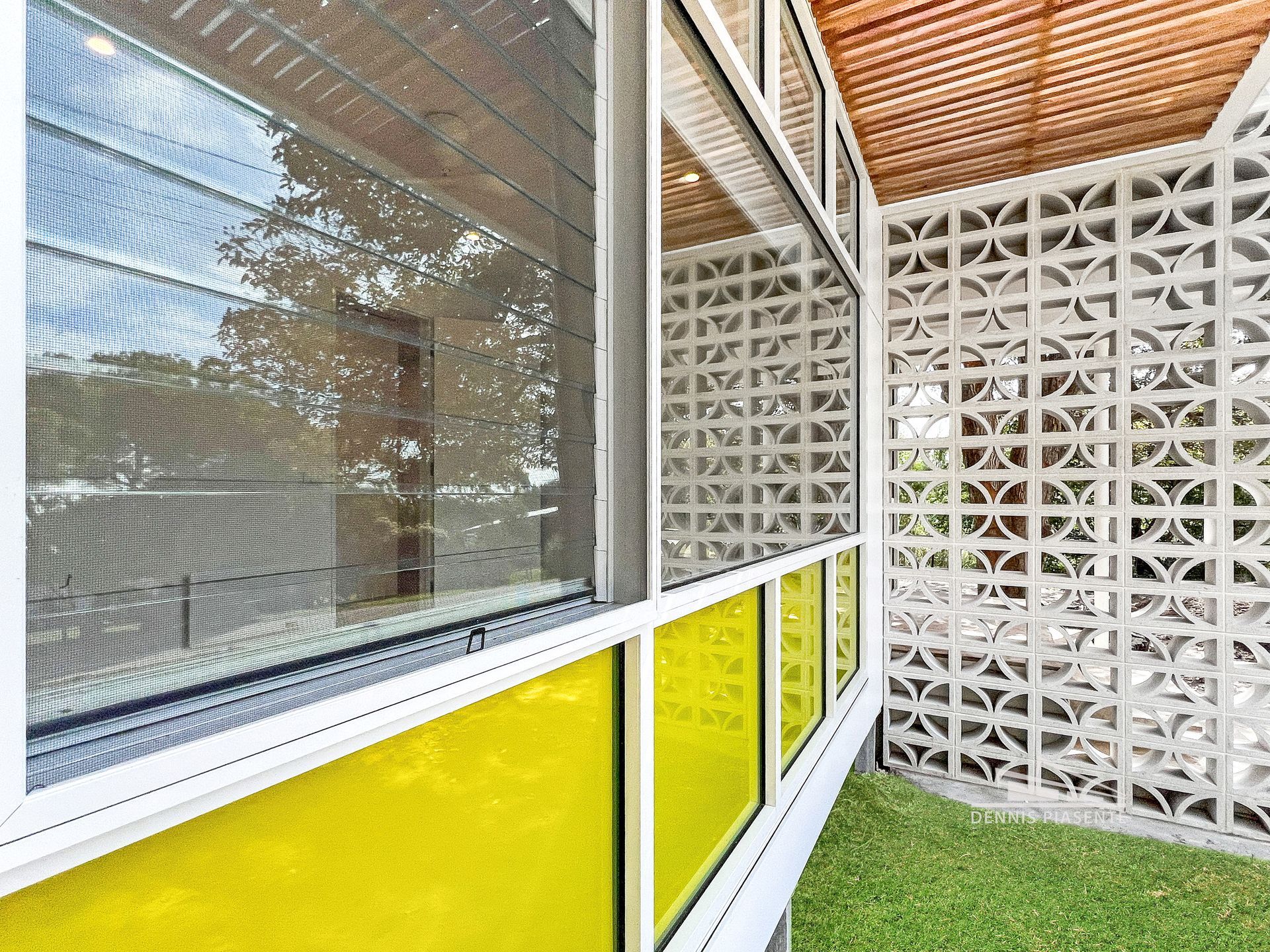 A building with a lot of windows and a brick wall.