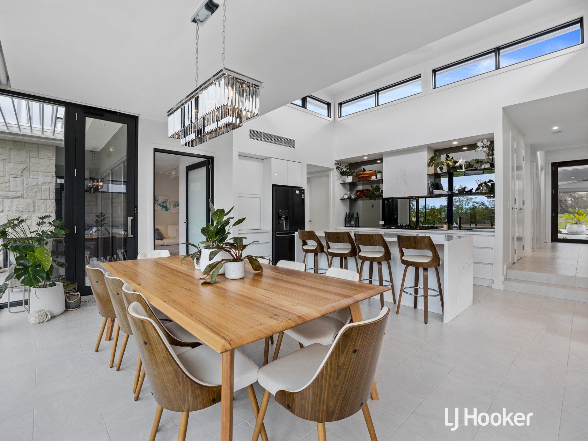 A dining room table and chairs in a modern house.