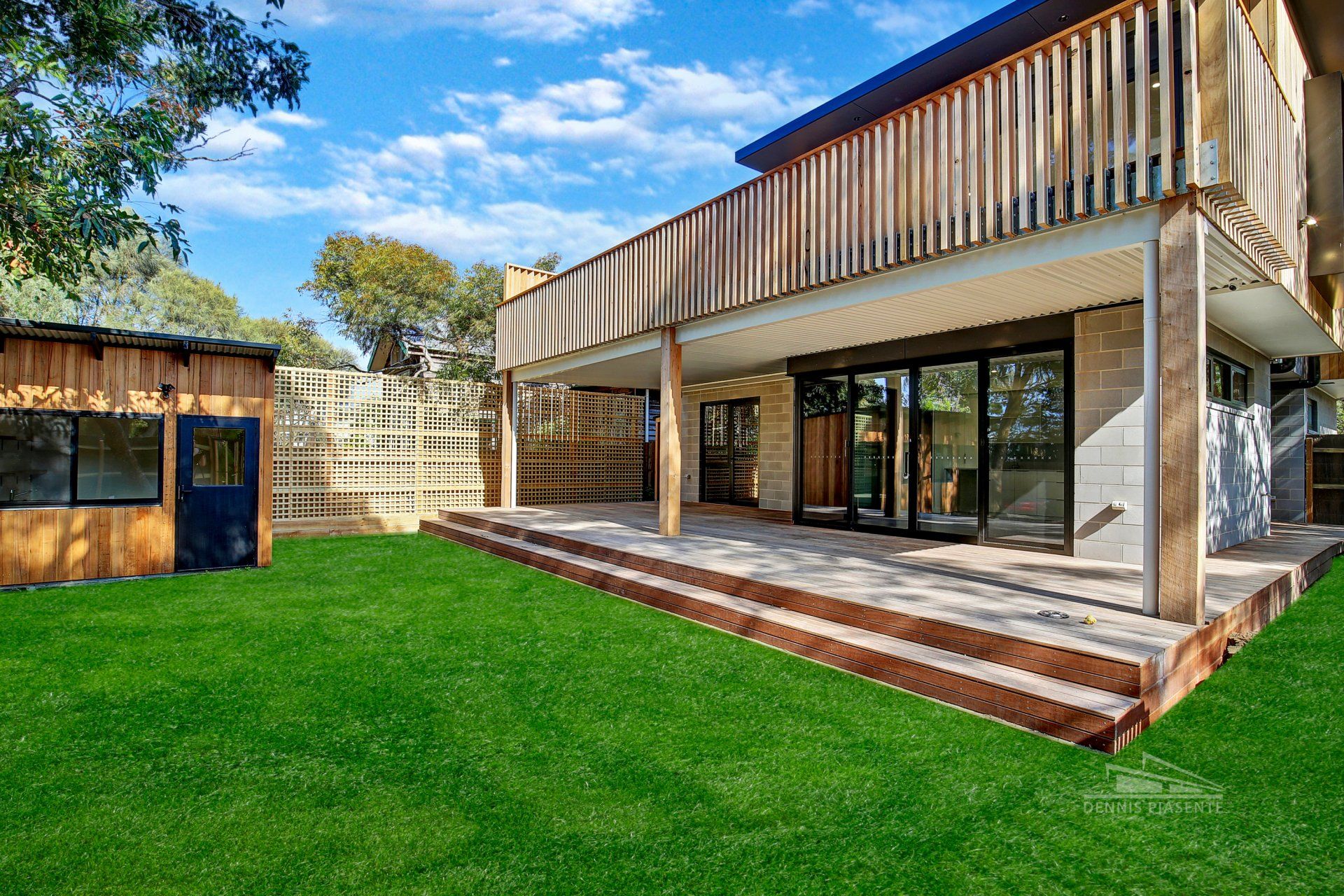 A large house with a large lawn in front of it.