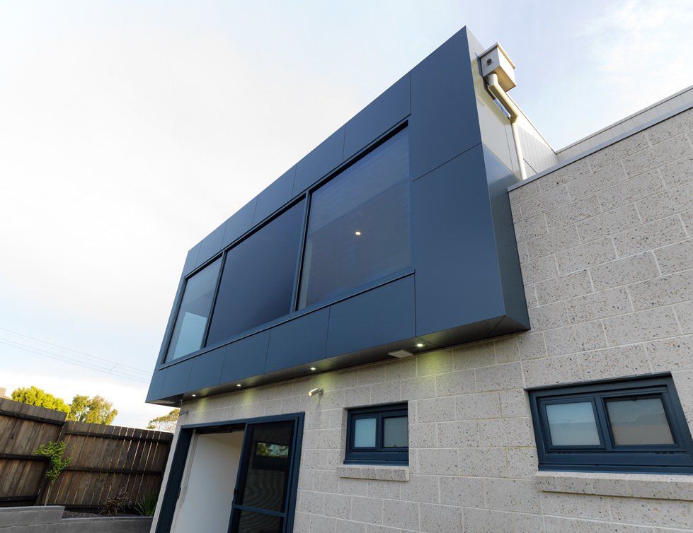 A large building with a lot of windows and a balcony