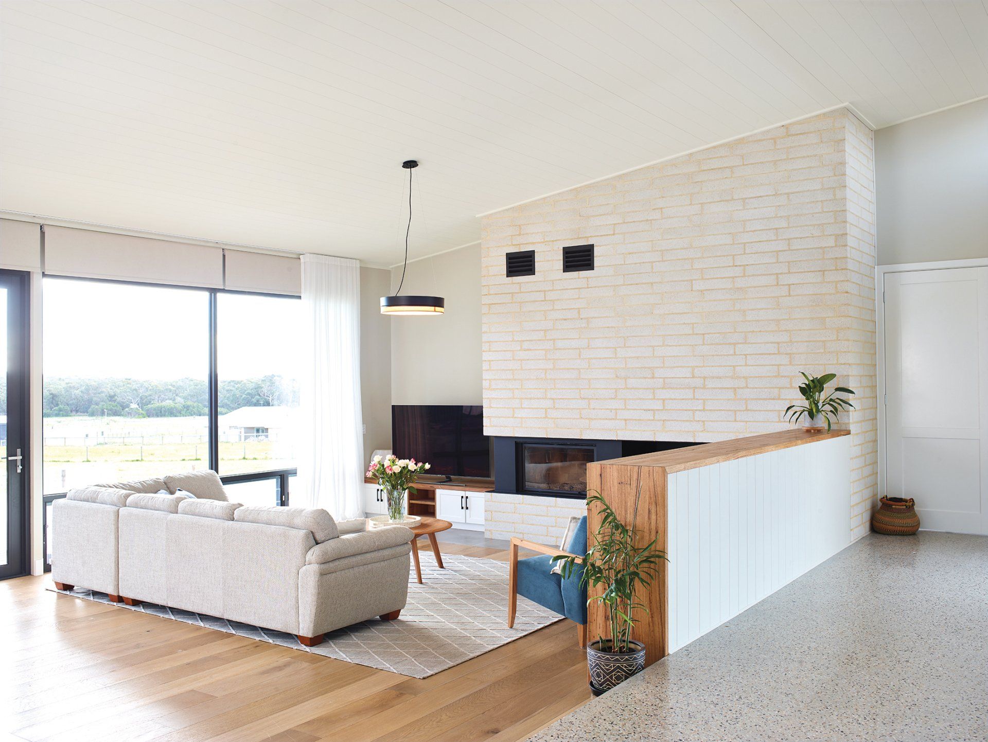 A living room filled with furniture and a fireplace.