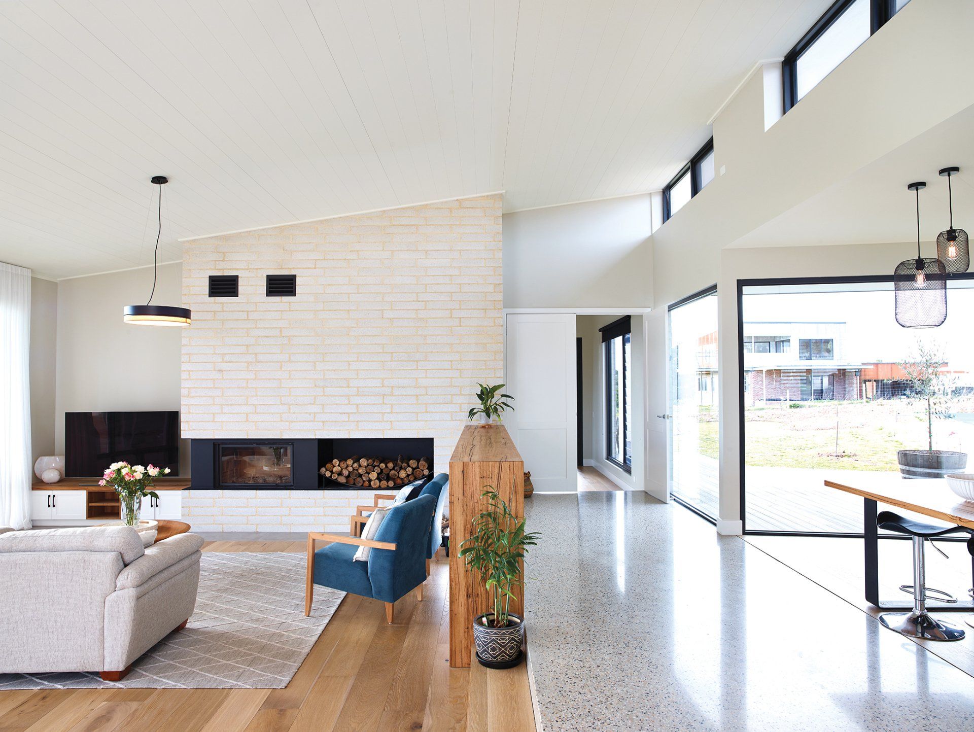 A living room filled with furniture and a fireplace