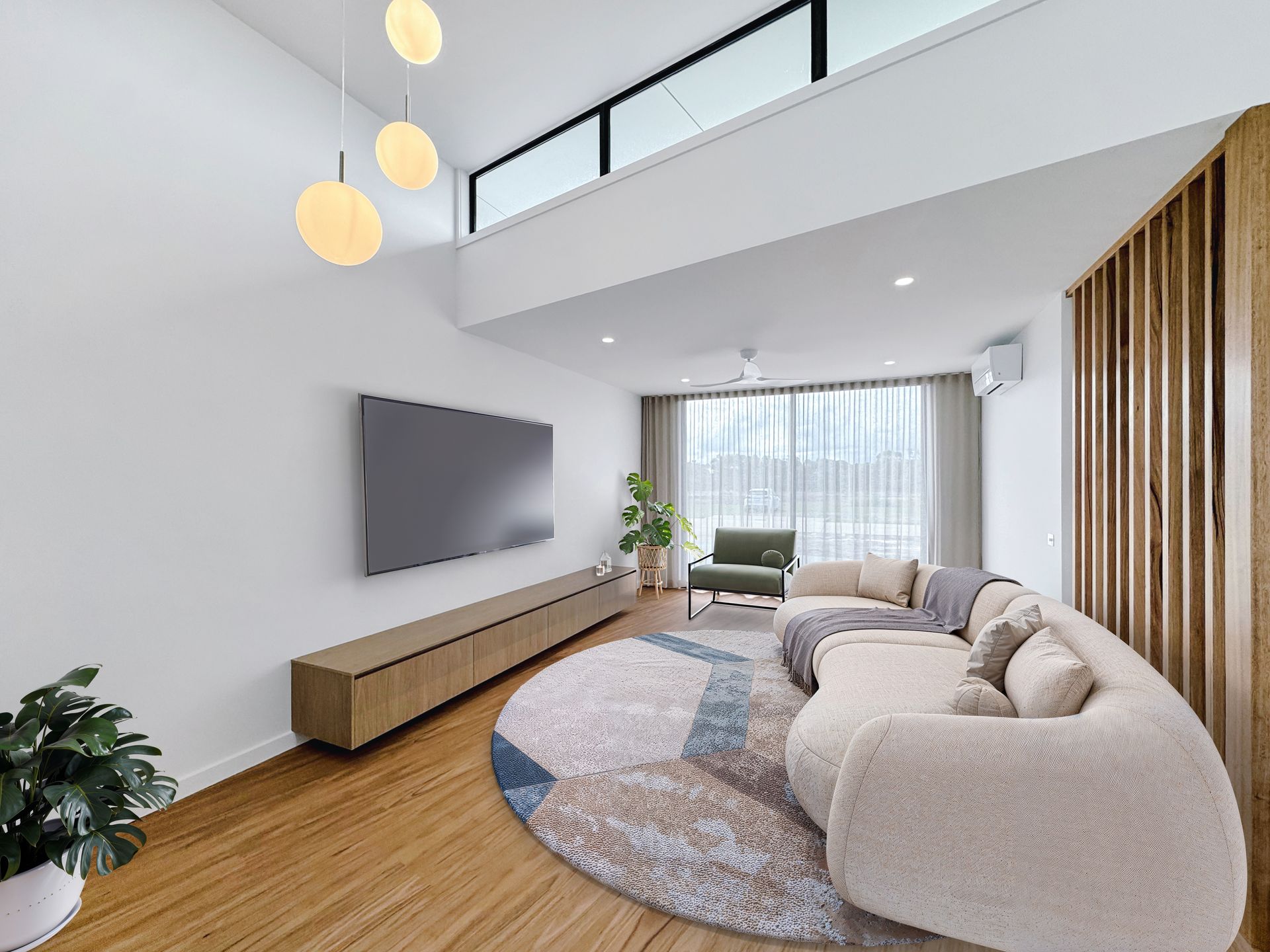 A living room with a couch and a flat screen tv.