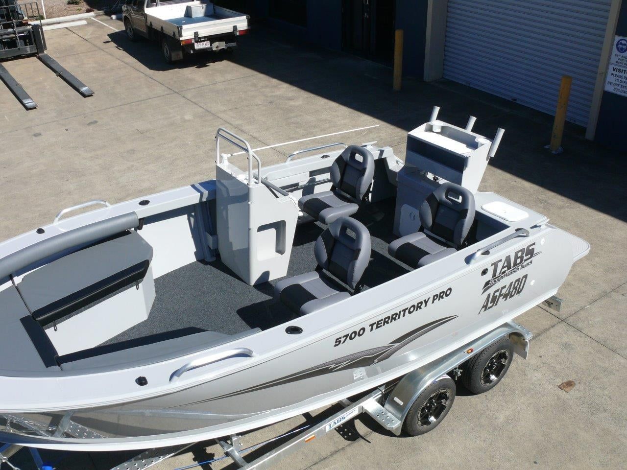 Aluminium Fishing Boat On Trailer. Gray Interior, Two Seats, Gray Deck, Outdoors — In Tune Marine in Mackay, QLD