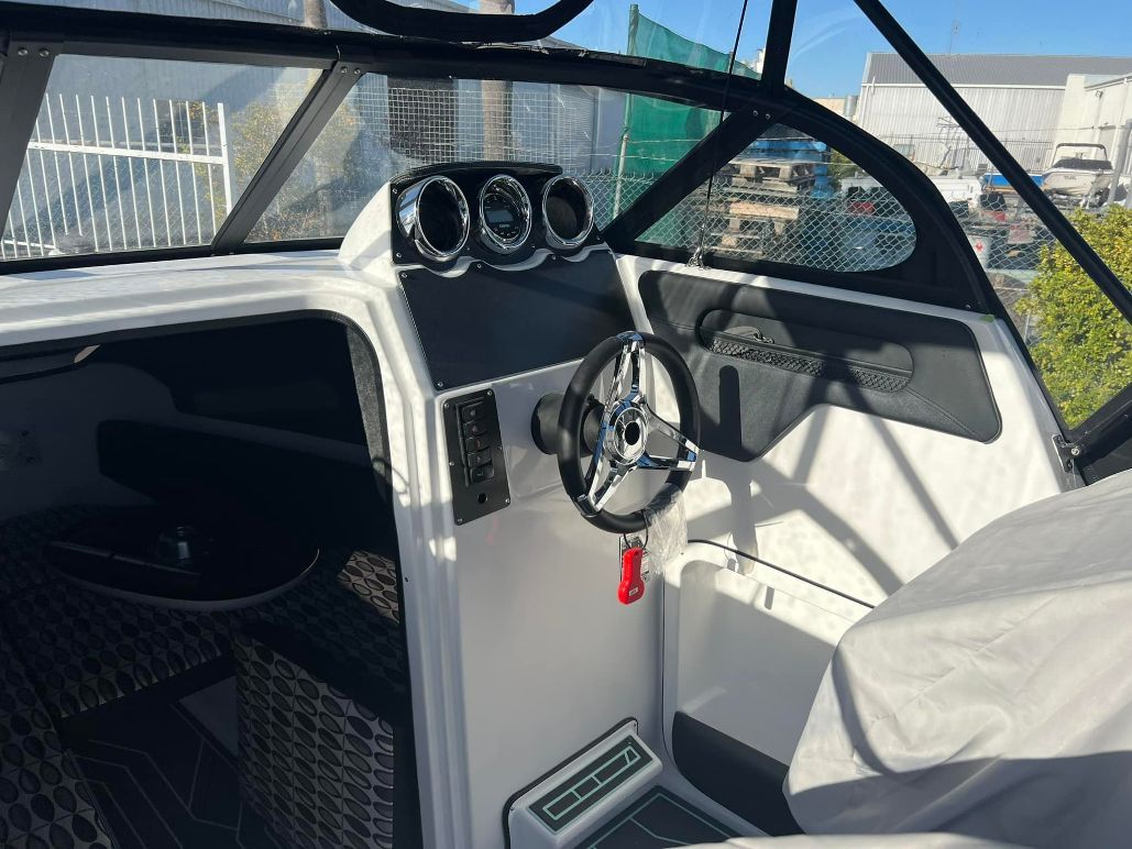 Interior View of a White Boat's Helm — In Tune Marine in Airlie Beach, QLD