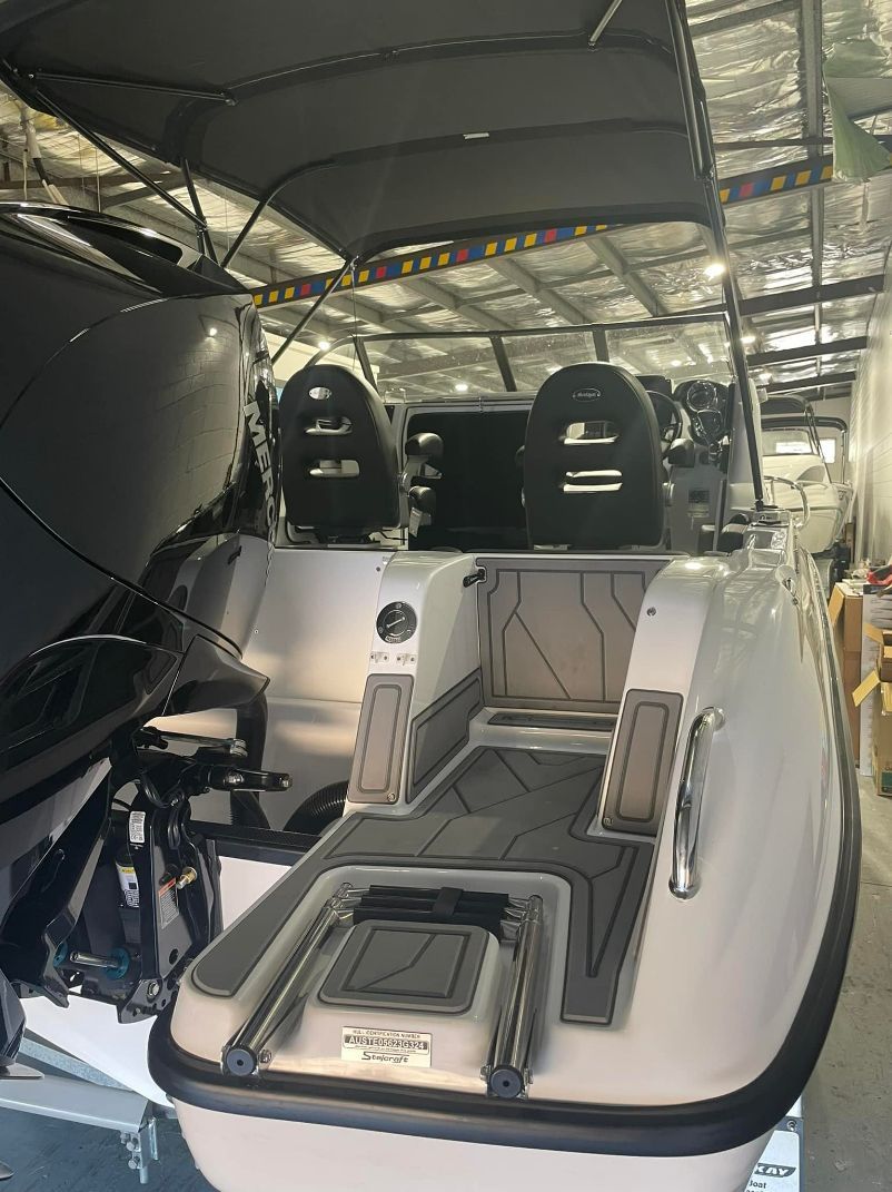 White Speedboat Interior, Black Seats, Grey Non-slip Flooring — In Tune Marine in West End, QLD